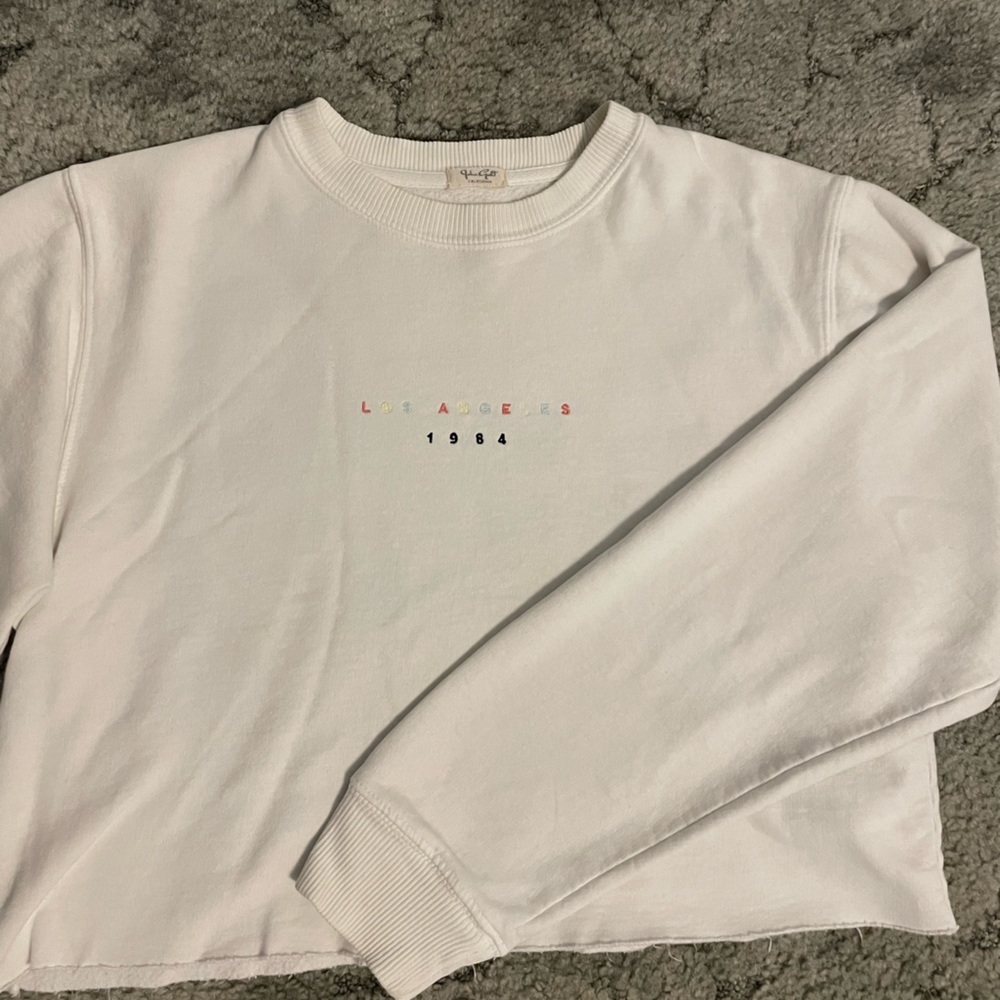 White, long sleeve, crop top, Los Angeles crew neck sweater.